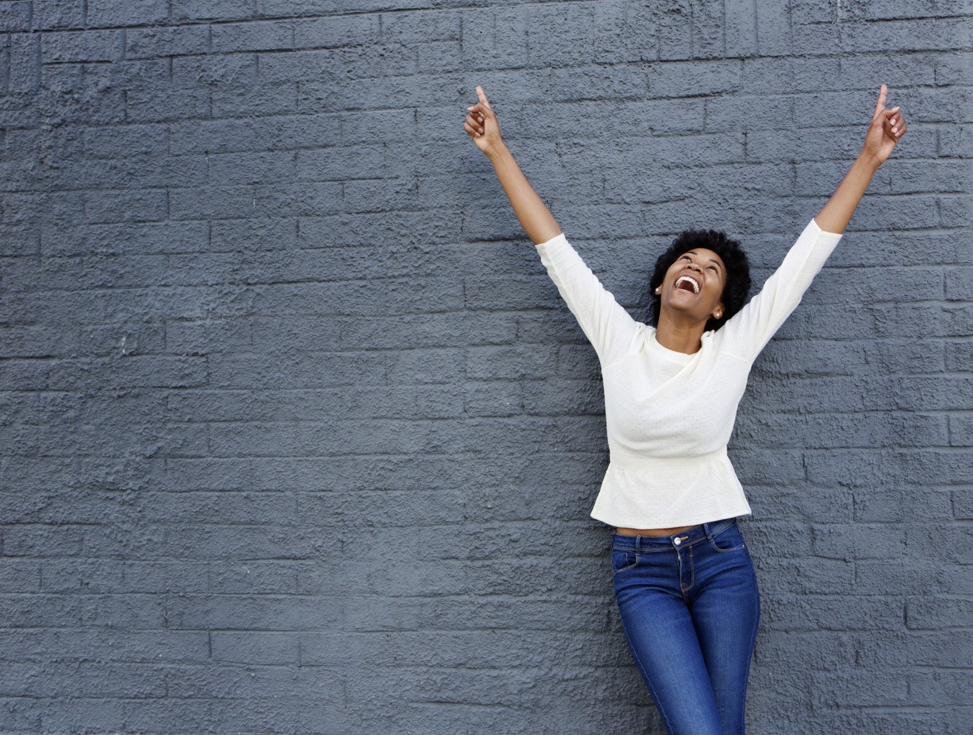 Woman with hands up in worship